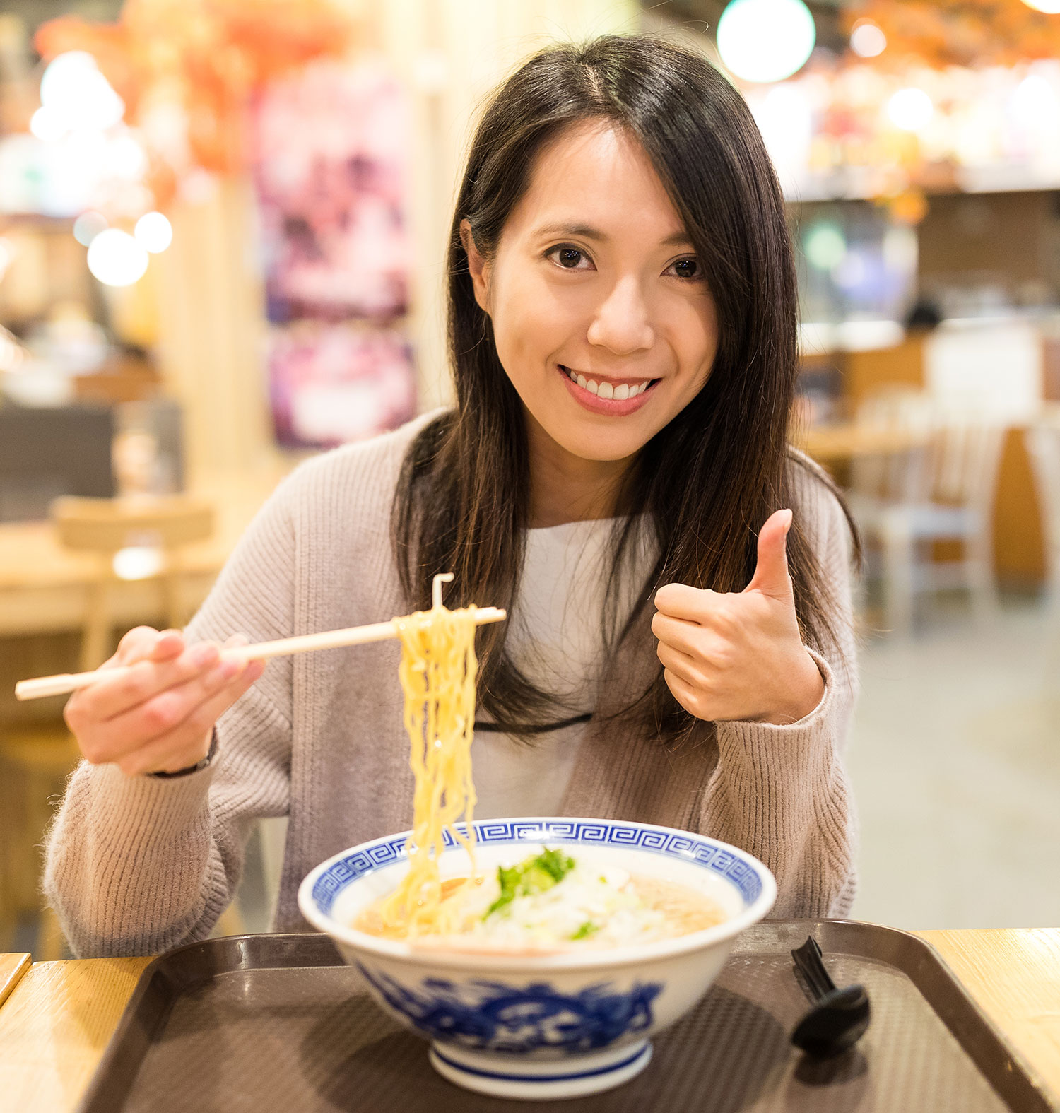 Asian girl eat jsl ramen noodles